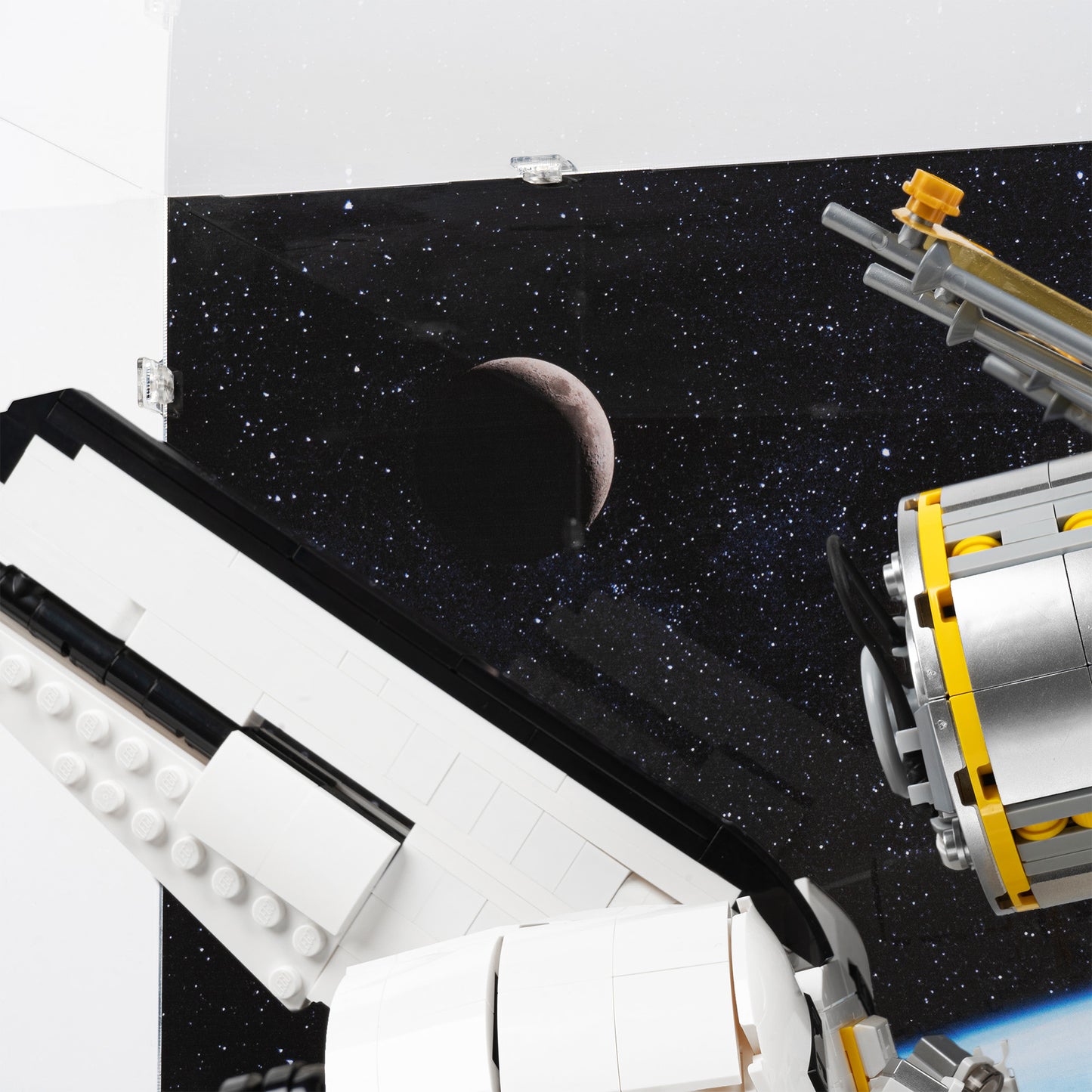 Moon detail view of LEGO 10283 NASA Space Shuttle Discovery Display Case with a UV printed background.