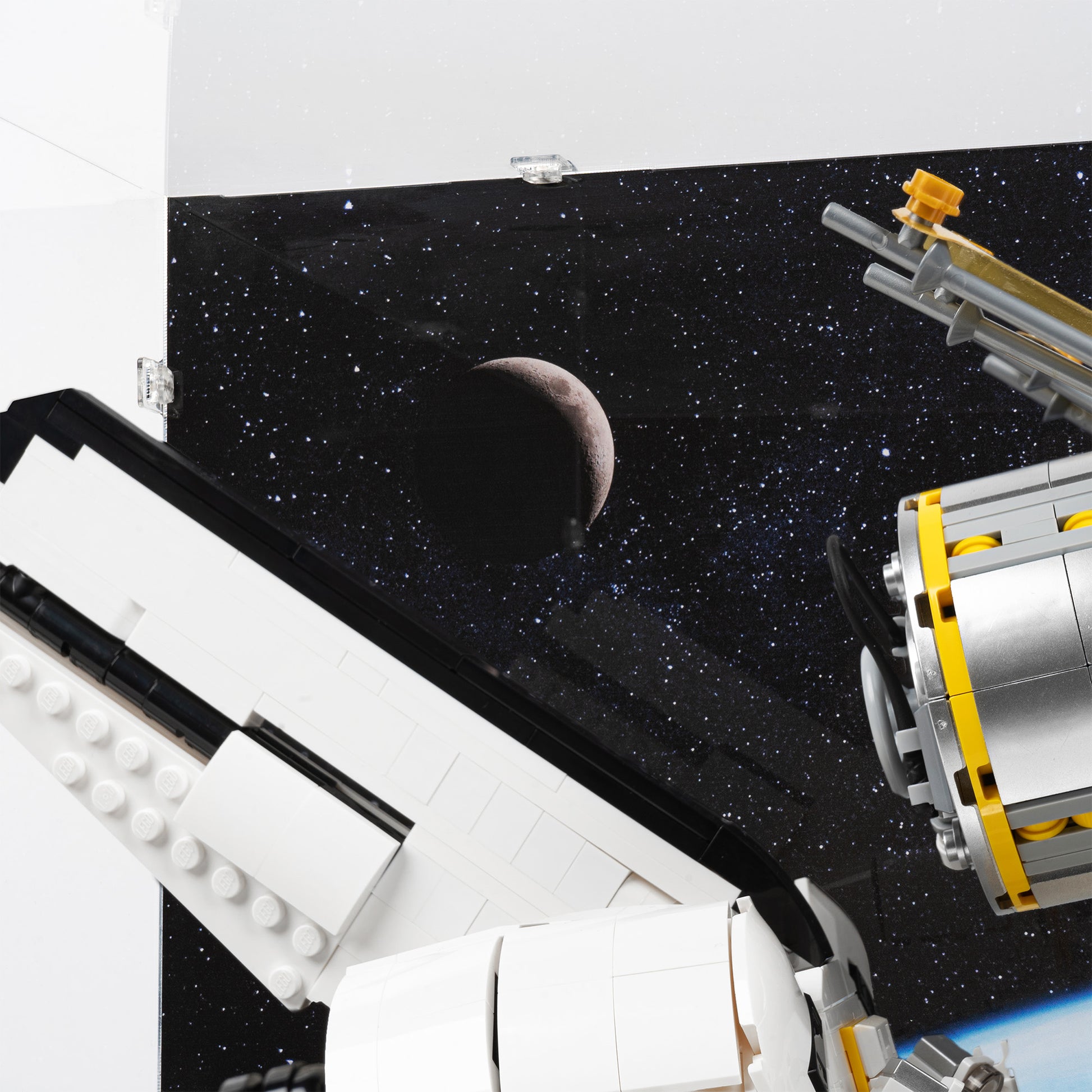 Moon detail view of LEGO 10283 NASA Space Shuttle Discovery Display Case with a UV printed background.