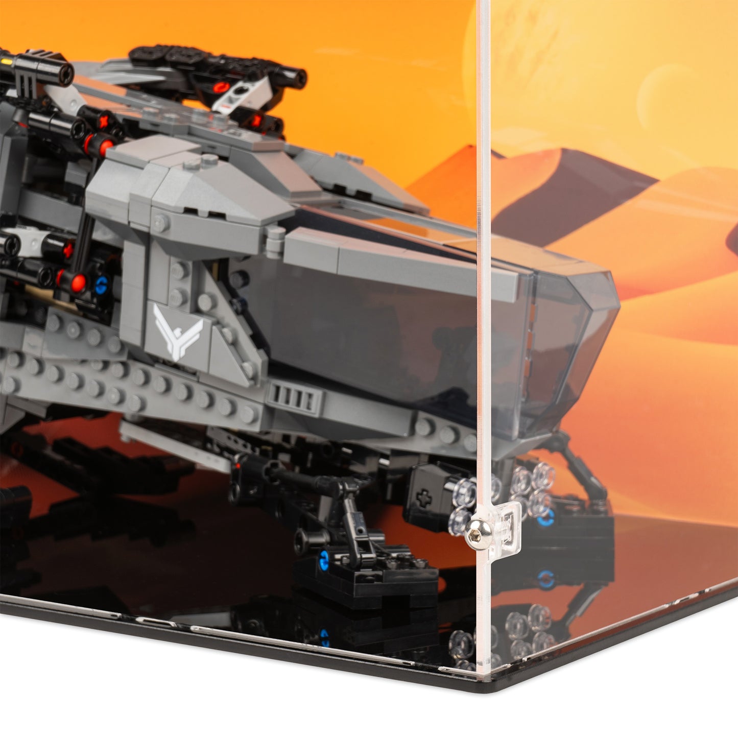 Fitting detail view of LEGO 10327 Dune Atreides Royal Ornithopter Display Case with a UV printed background.