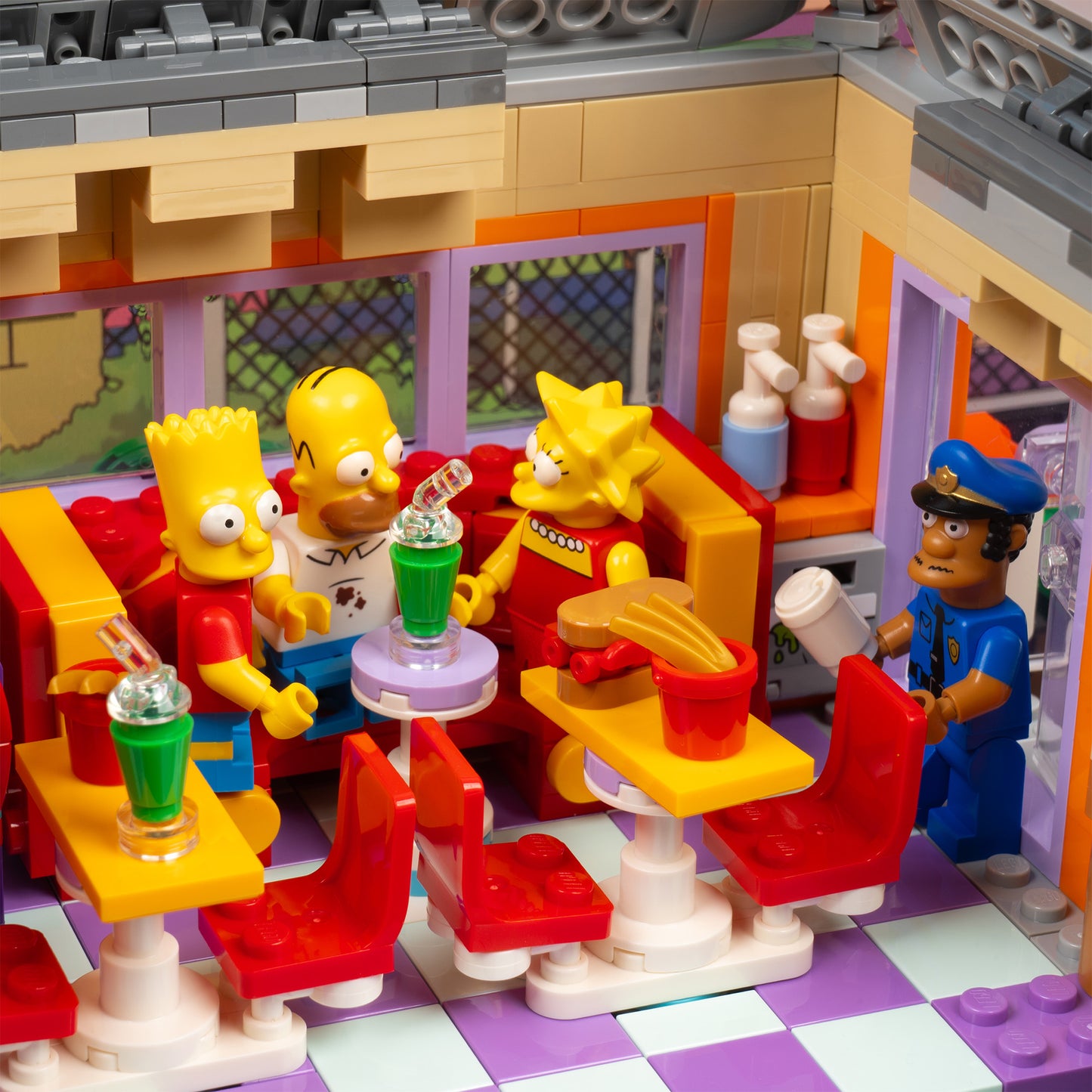 Interior detail view of LEGO 10352 The Simpsons Krusty Burger Display Case with a UV printed background.