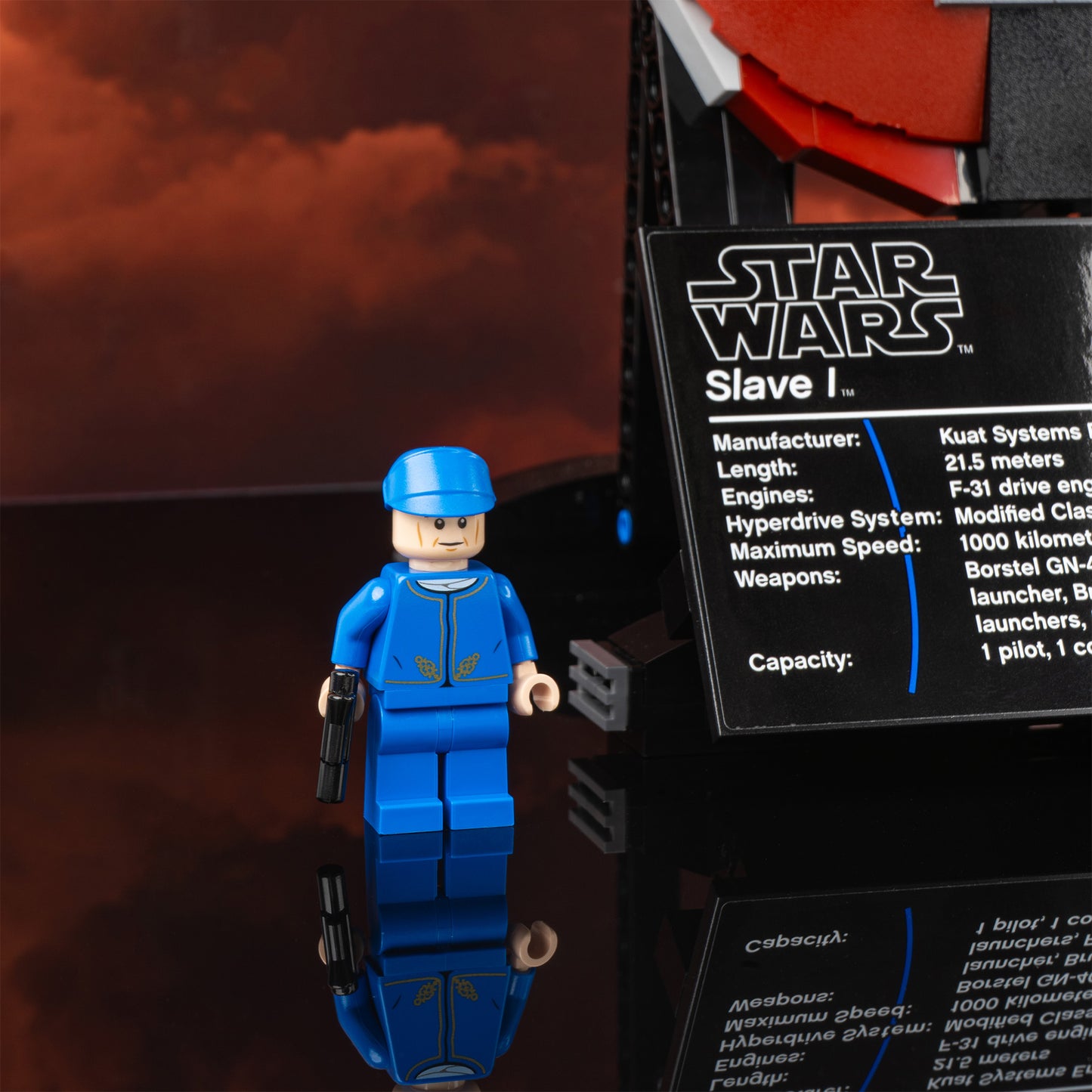 Plaque detail view of LEGO 75060 UCS Slave I Display Case with a UV printed background.