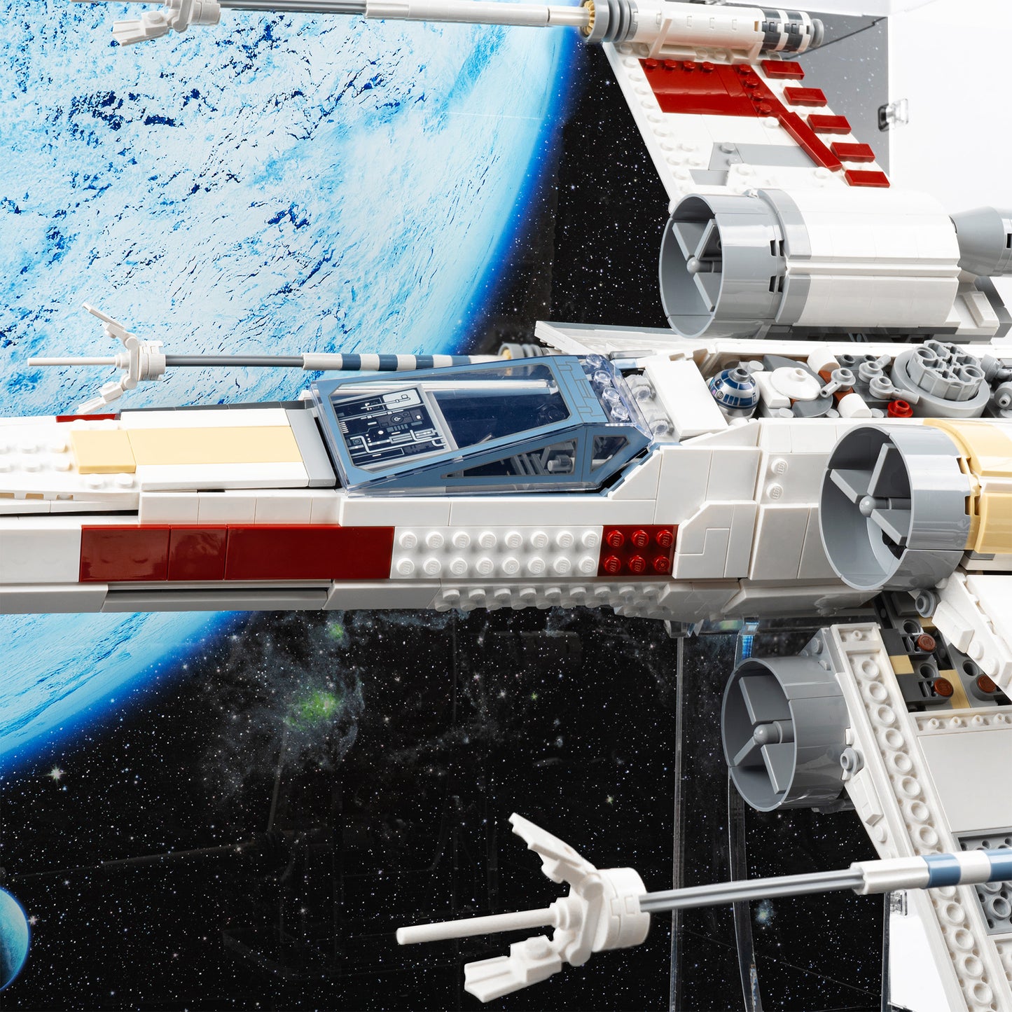 Cockpit detail view of LEGO 75355 UCS X-Wing Starfighter Display Case and Stand with a UV printed background.