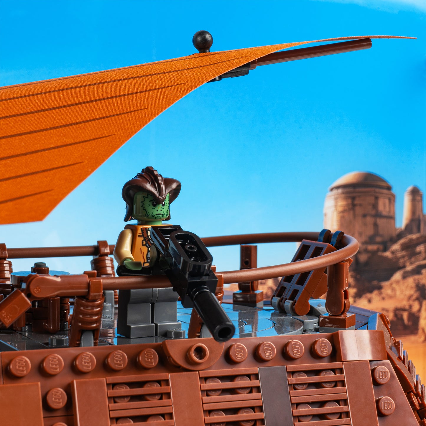Turret detail view of LEGO 75397 UCS Jabba's Sail Barge Display Case with a UV printed background.