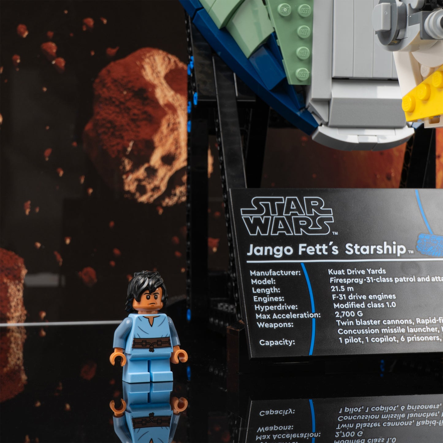 Plaque detail view of LEGO 75409 UCS Jango Fett's Firespray-Class Starship Display Case with a UV printed background.