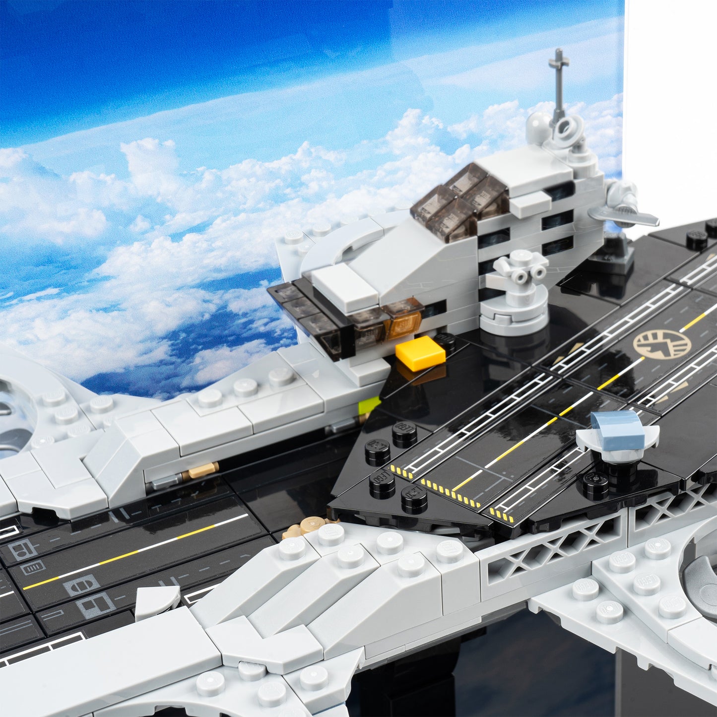 Runway detail view of LEGO 76295 The Avengers Helicarrier Display Case with a UV printed background.