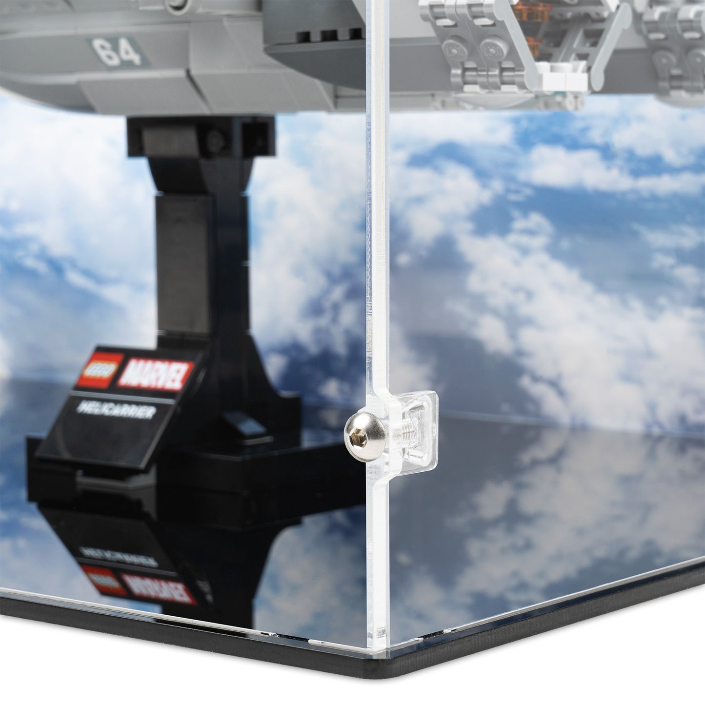 Fitting detail view of LEGO 76295 The Avengers Helicarrier Display Case with a UV printed background.