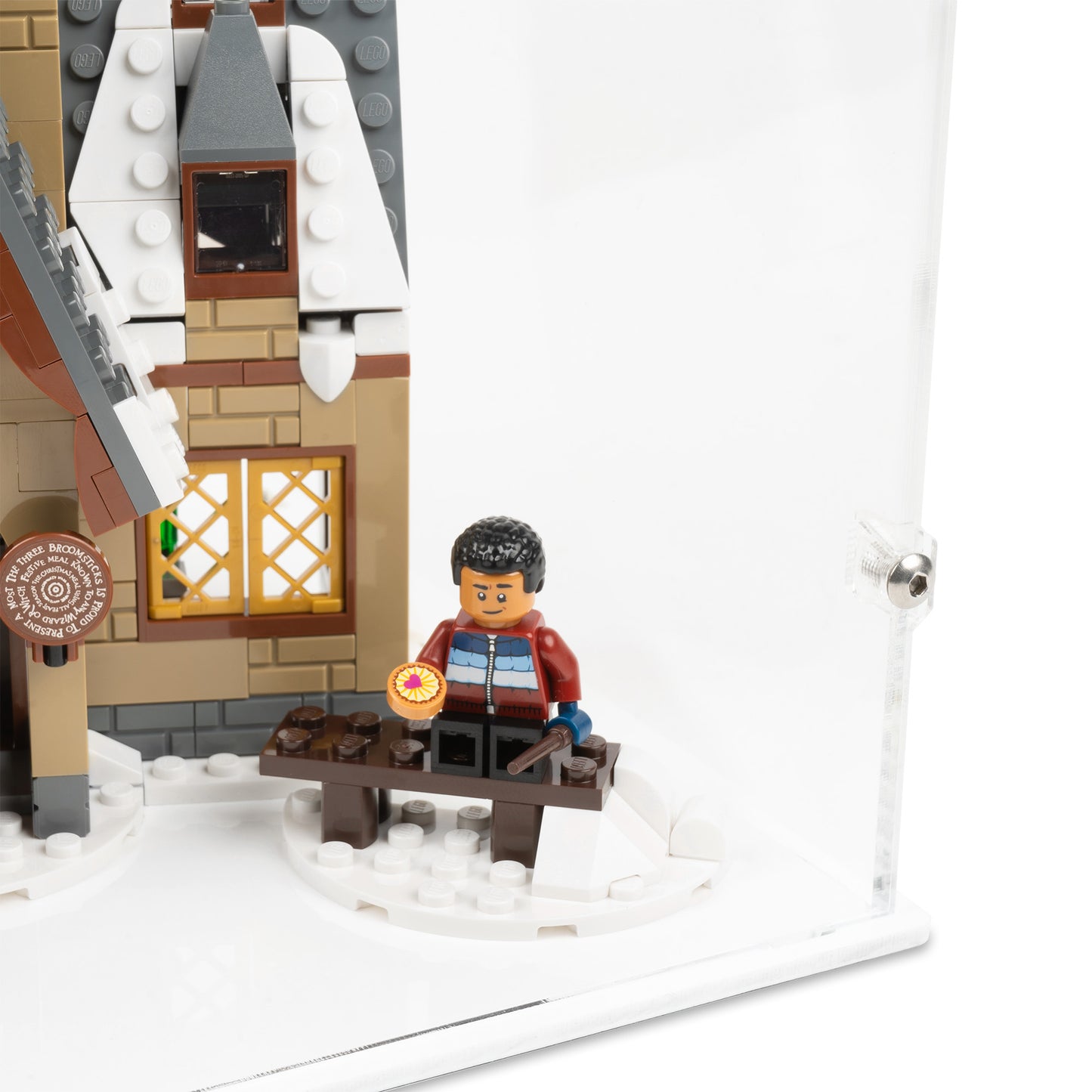 Fitting detail view of LEGO 76388 Hogsmeade Village Visit Display Case with a white base.