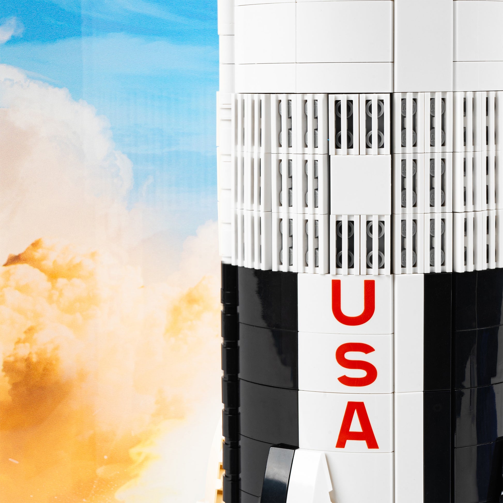 Rocket detail view of LEGO 92176/21309 NASA Apollo Saturn V Vertical Display Case with a UV printed background.