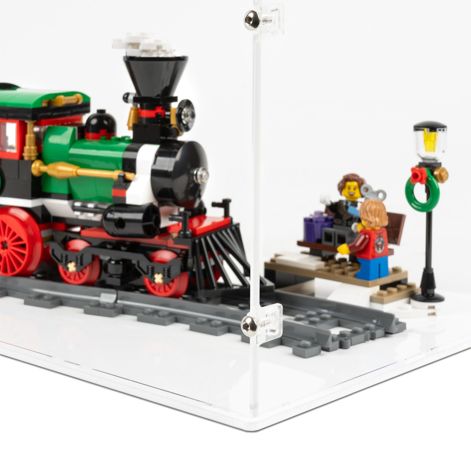Fitting detail view of LEGO 10254 Winter Holiday Train Display Case with a white base.