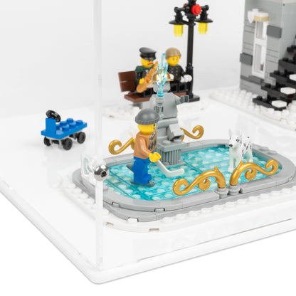 Fitting detail view of LEGO 10263 Winter Village Fire Station Display Case with a white base.