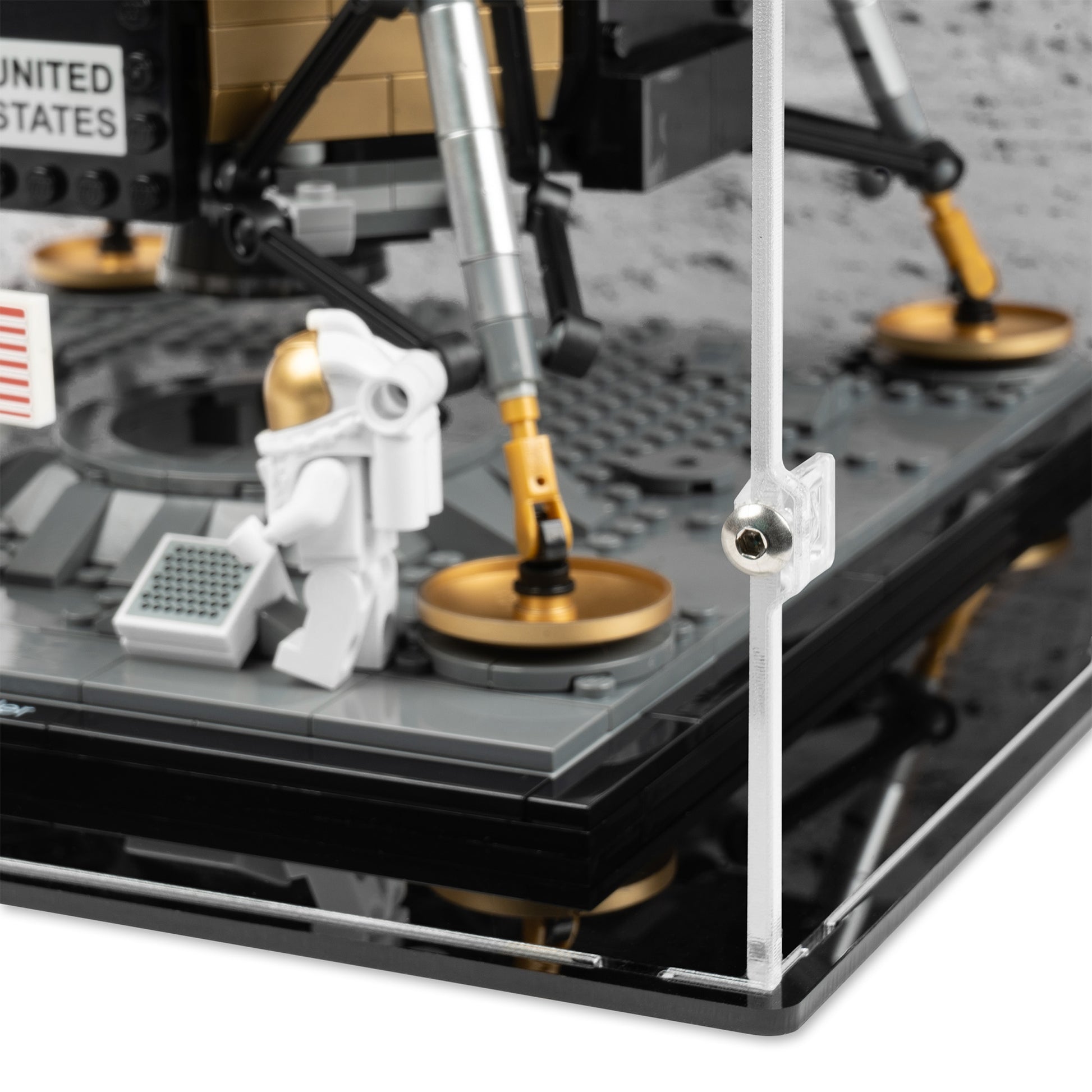 Fitting detail view of LEGO 10266 NASA Apollo 11 Lunar Lander Display Case with a UV printed background.