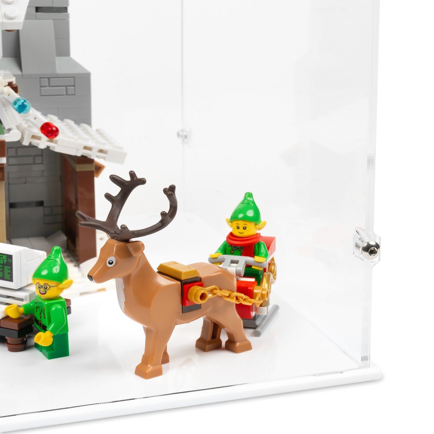 Fitting detail view of LEGO 10275 Elf Club House Display Case with a white base.