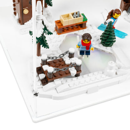 Fitting detail view of LEGO 10325 Alpine Lodge Display Case with a white base.