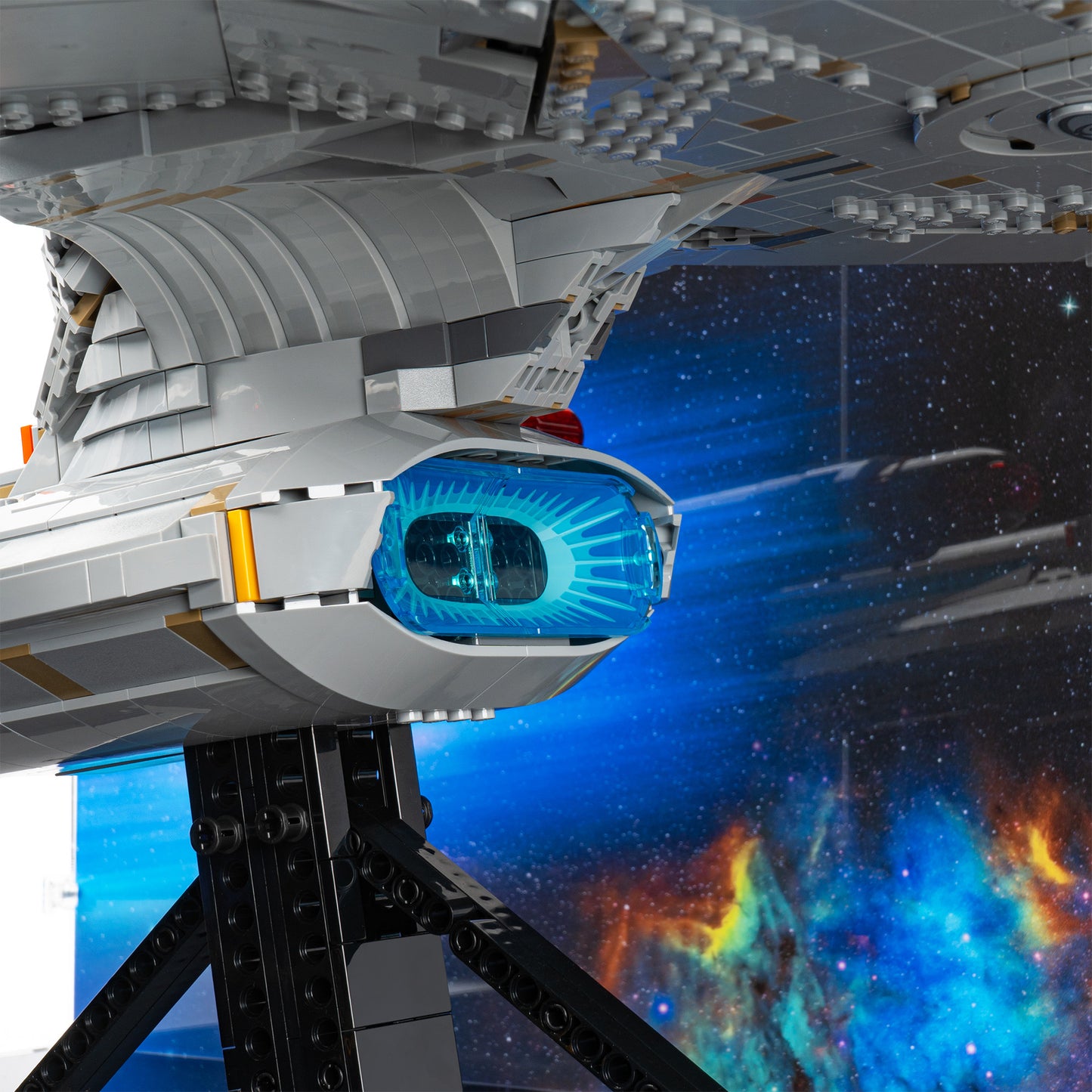 Deflector dish detail view of LEGO 10356 Star Trek USS Enterprise NCC-1701-D Display Case with a UV printed background.