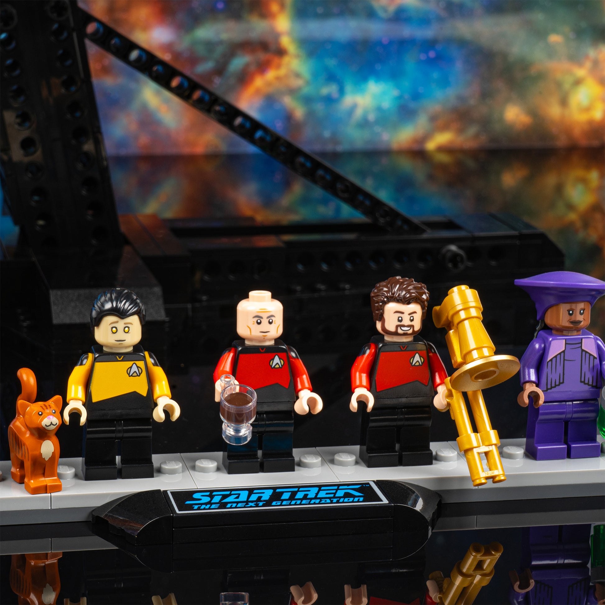 Crew detail view of LEGO 10356 Star Trek USS Enterprise NCC-1701-D Display Case with a UV printed background.