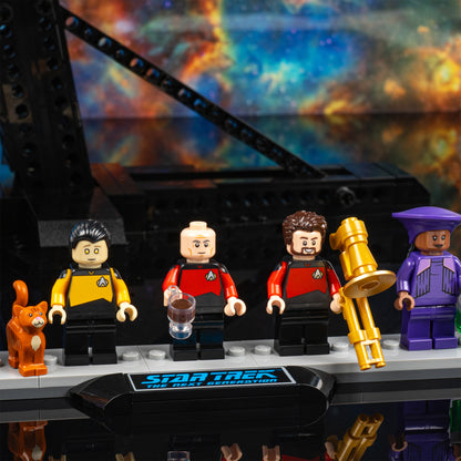 Crew detail view of LEGO 10356 Star Trek USS Enterprise NCC-1701-D Display Case with a UV printed background.