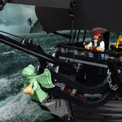 Bowsprit detail view of LEGO 10365 Captain Jack Sparrow's Pirate Ship Display Case with a UV printed background.