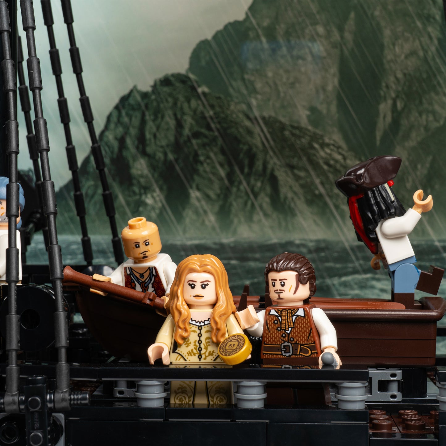 Deck detail view of LEGO 10365 Captain Jack Sparrow's Pirate Ship Display Case with a UV printed background.