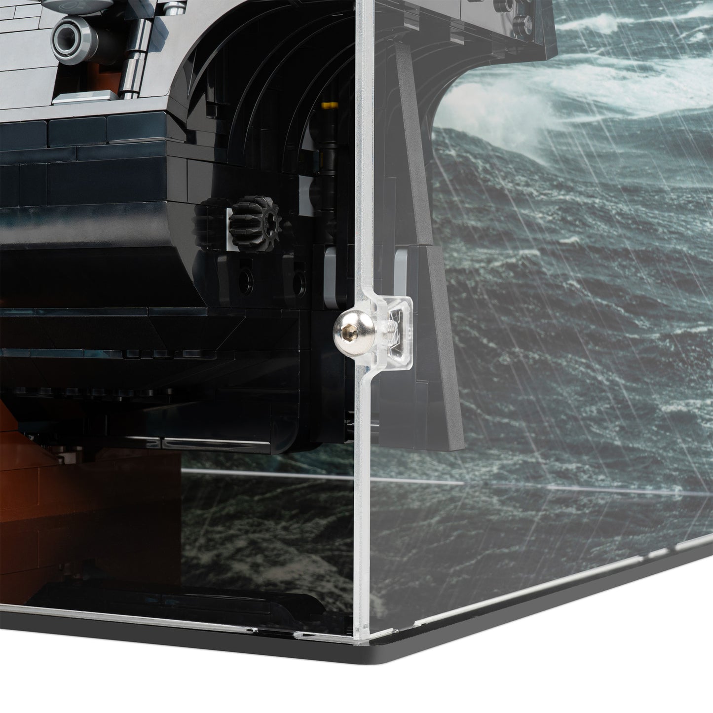 Fitting detail view of LEGO 10365 Captain Jack Sparrow's Pirate Ship Display Case with a UV printed background.