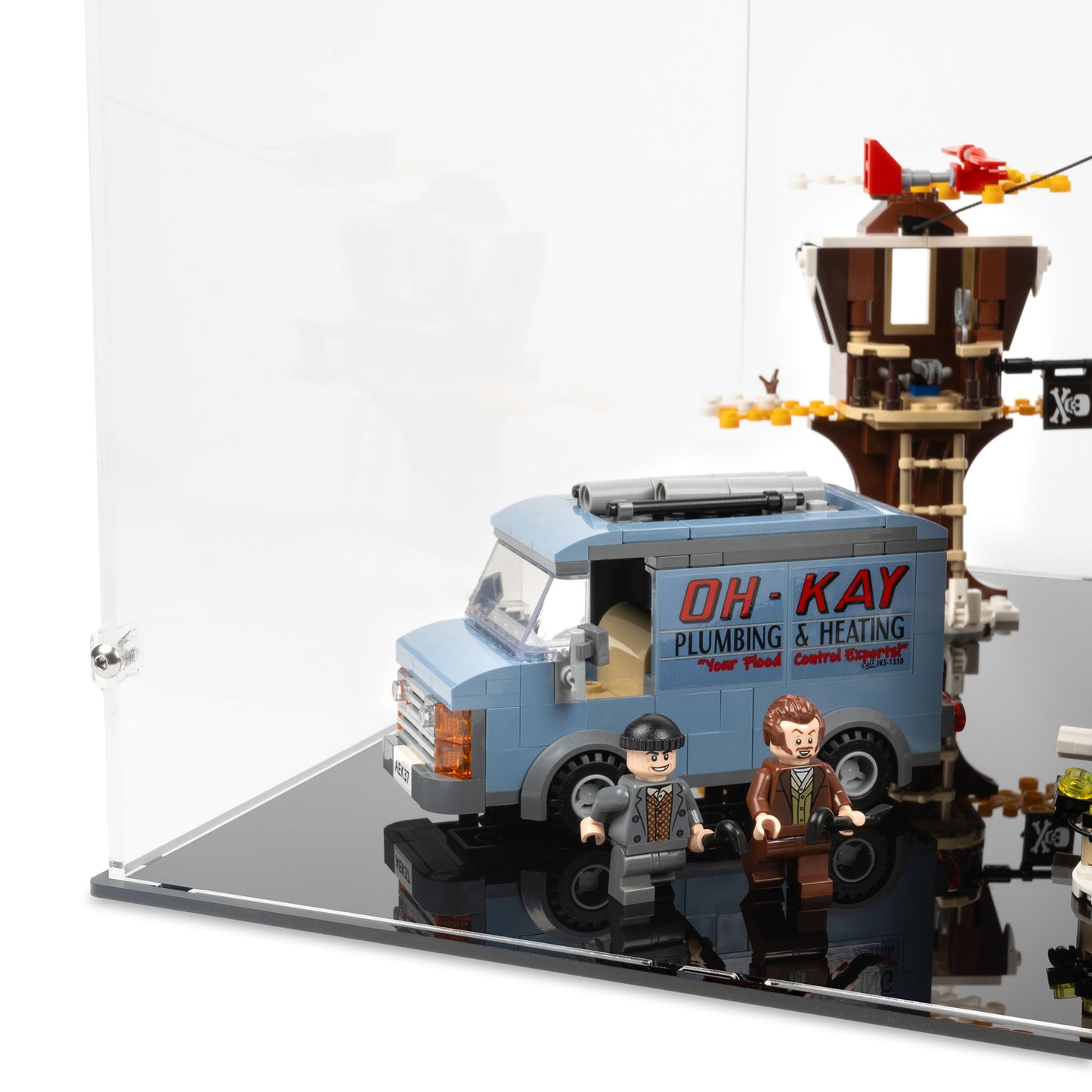 Fitting detail view of LEGO 21330 Home Alone Display Case with a black base.