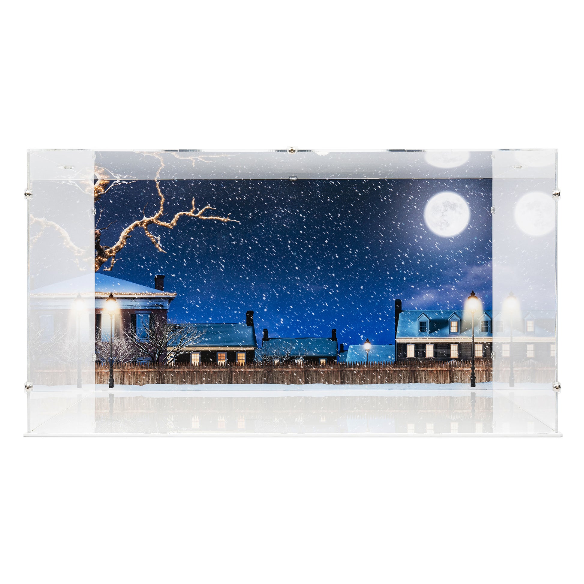 Front view of empty LEGO 21330 Home Alone Display Case with a white base and a UV printed background.