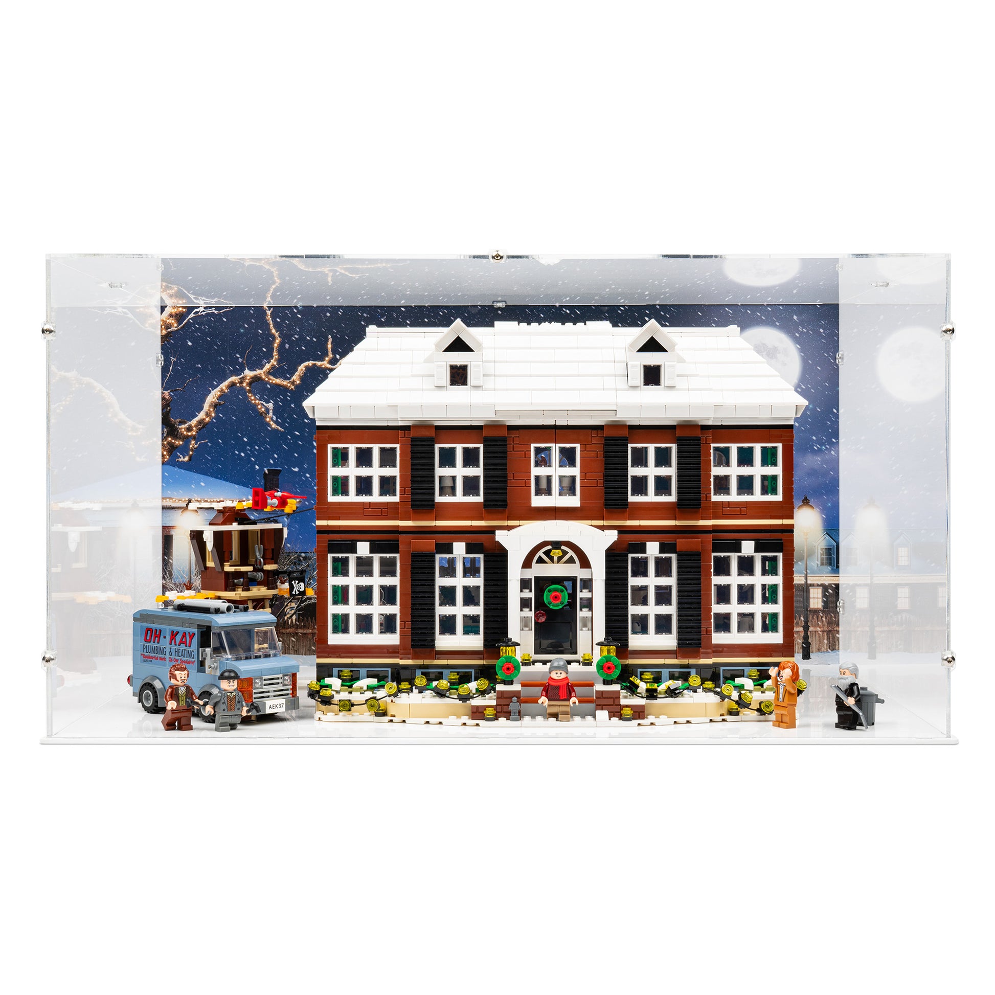 Front view of LEGO 21330 Home Alone Display Case with a white base and a UV printed background.