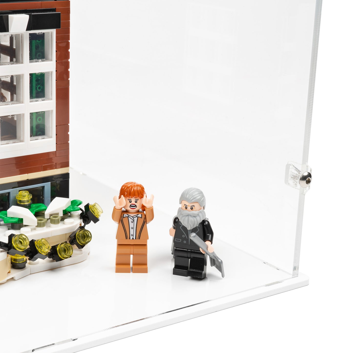 Fitting detail view of LEGO 21330 Home Alone Display Case with a white base.