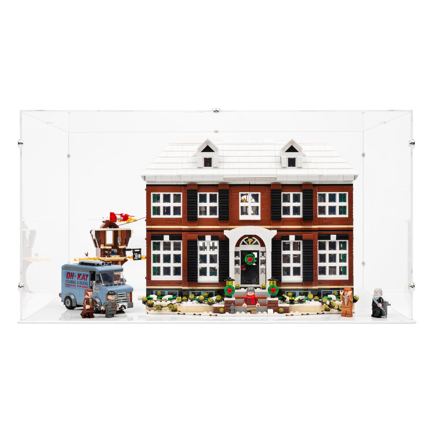 Front view of LEGO 21330 Home Alone Display Case with a white base.