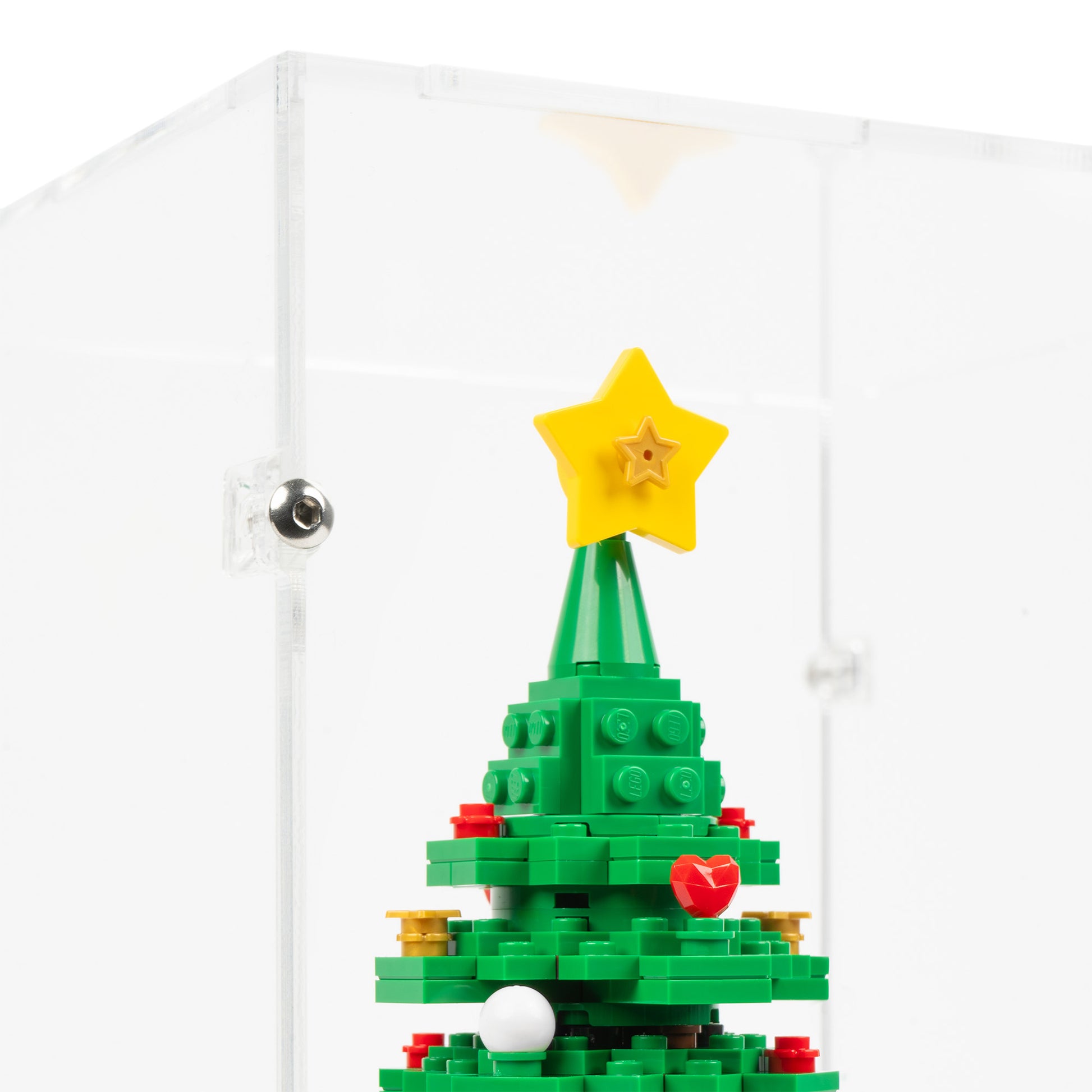 Fitting detail view of LEGO 40573 Christmas Tree Display Case with a black base.