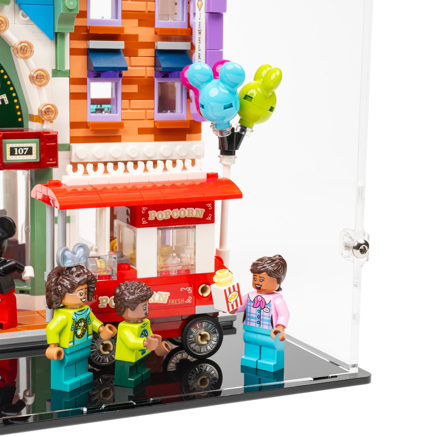 Fitting detail view of LEGO 43302 Main Street, USA Display Case.