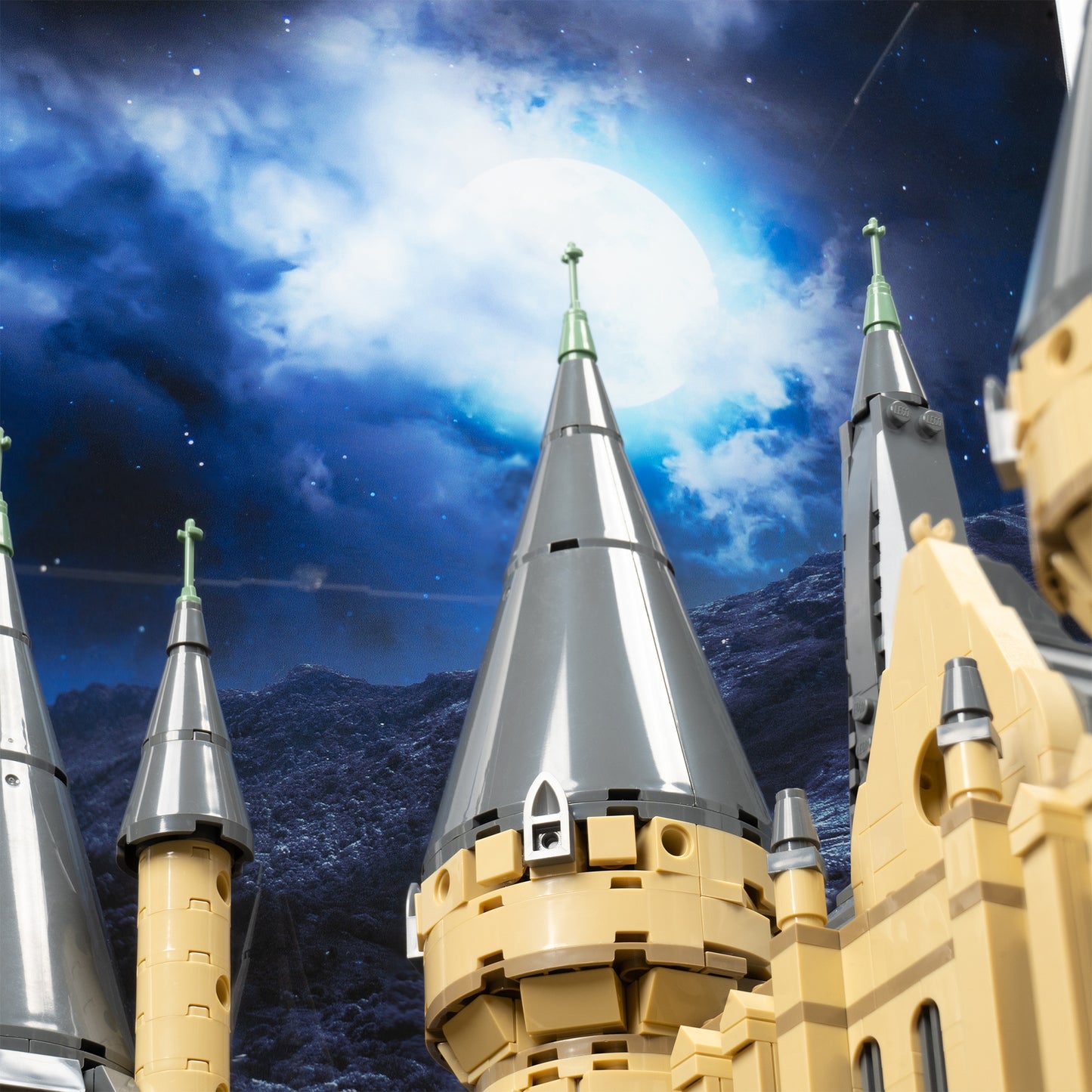 Spires detail view of LEGO 71043 Hogwarts Castle Display Case with a UV printed background.