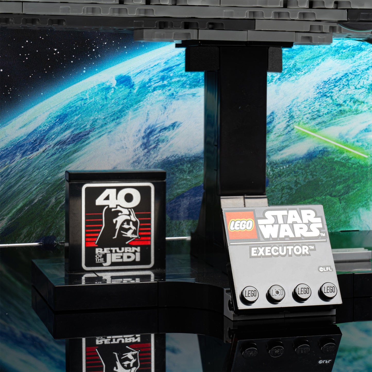 Plaque detail view of LEGO 75356 Executor Super Star Destroyer Display Case with a UV printed background.