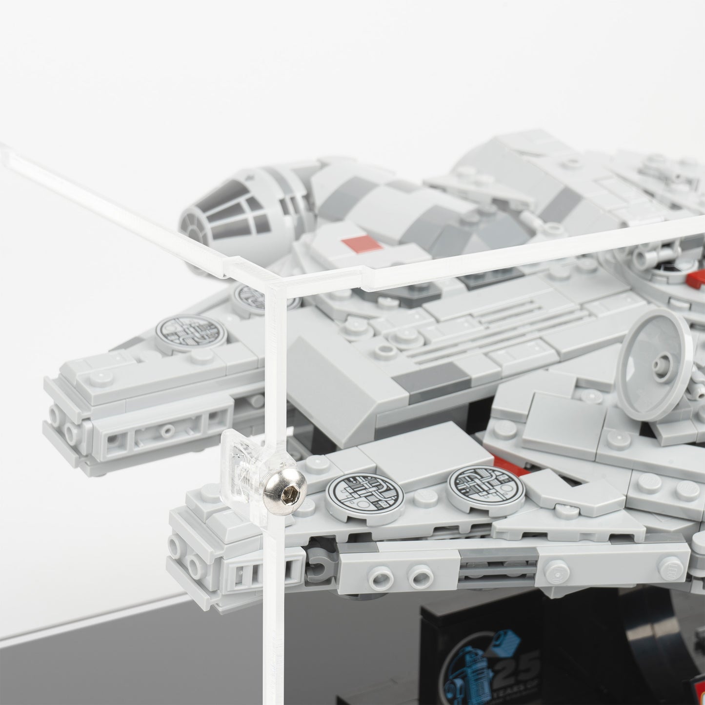 Fitting detail view of LEGO 75375 Millennium Falcon Display Case.