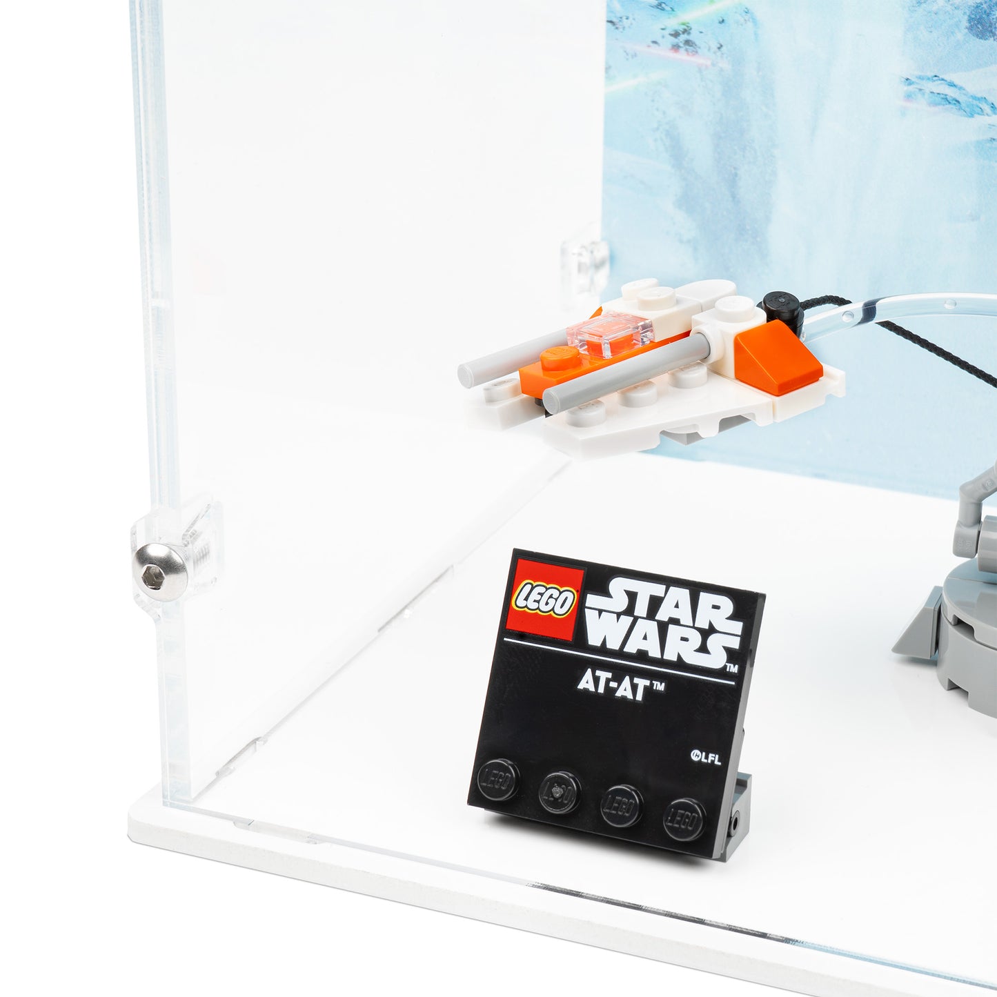 Fitting detail view of LEGO 75440 AT-AT Display Case with a white base and a UV printed background.
